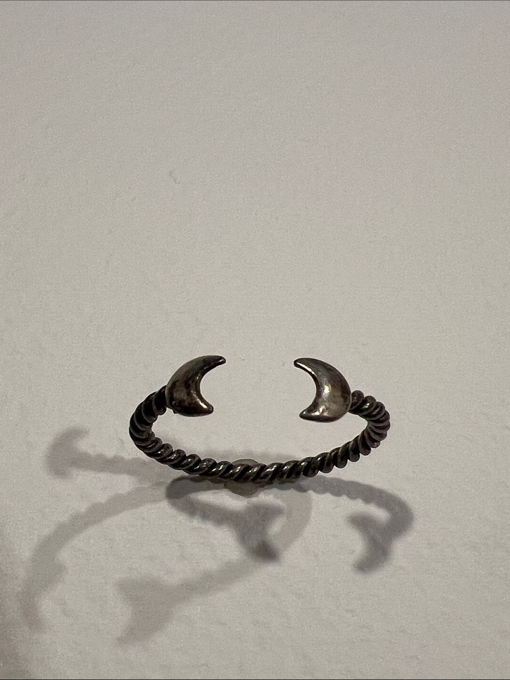 Sterling Silver Twisted Ring with Crescent Moon Ends
